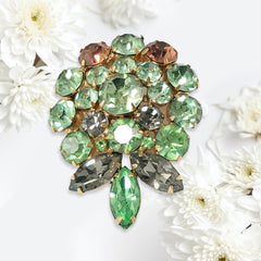Vintage Weiss green and smoked topaz rhinestone teardrop brooch with gold‑tone setting.