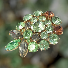 Vintage Weiss green and smoked topaz rhinestone teardrop brooch with gold‑tone setting.