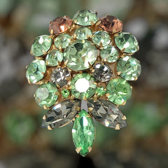Vintage Weiss green and smoked topaz rhinestone teardrop brooch with gold‑tone setting.