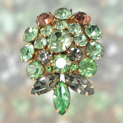 Vintage Weiss green and smoked topaz rhinestone teardrop brooch with gold‑tone setting.