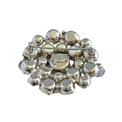 Vintage 1950s Weiss round brooch with light amethyst and amethyst AB rhinestones arranged in a layered cluster, set in rhodium‑plated metal with a dangling bead accent