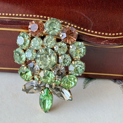 Vintage Weiss green and smoked topaz rhinestone teardrop brooch with gold‑tone setting.