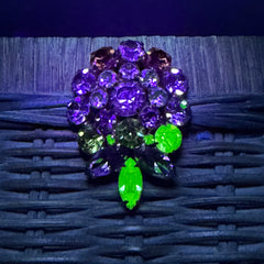 Vintage Weiss green and smoked topaz rhinestone teardrop brooch with gold‑tone setting.