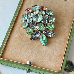 Vintage Weiss green and smoked topaz rhinestone teardrop brooch with gold‑tone setting.