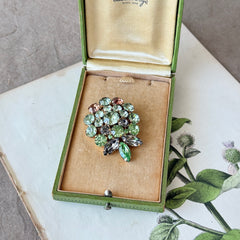 Vintage Weiss green and smoked topaz rhinestone teardrop brooch with gold‑tone setting.