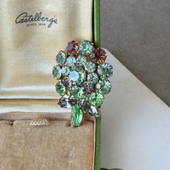 Vintage Weiss green and smoked topaz rhinestone teardrop brooch with gold‑tone setting.
