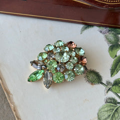 Vintage Weiss green and smoked topaz rhinestone teardrop brooch with gold‑tone setting.
