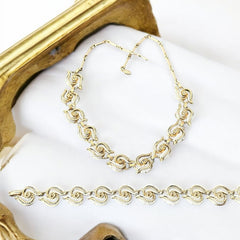 Vintage 1950s white enamel and gold-tone necklace and bracelet set with openwork textured wire design, adjustable hook clasp necklace and snap lock bracelet, in very good condition with light enamel wear.