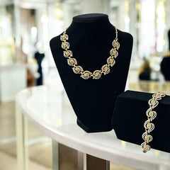 Vintage 1950s white enamel and gold-tone necklace and bracelet set with openwork textured wire design, adjustable hook clasp necklace and snap lock bracelet, in very good condition with light enamel wear.