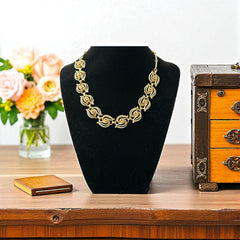 Vintage 1950s white enamel and gold-tone necklace and bracelet set with openwork textured wire design, adjustable hook clasp necklace and snap lock bracelet, in very good condition with light enamel wear.