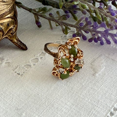 Vintage 1980s gold ring with jade oval cabochons and clear rhinestones in an organic sculptural setting, shown from multiple angles.