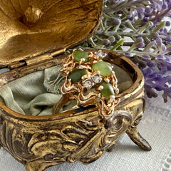 Vintage 1980s gold ring with jade oval cabochons and clear rhinestones in an organic sculptural setting, shown from multiple angles.