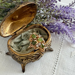 Vintage 1980s gold ring with jade oval cabochons and clear rhinestones in an organic sculptural setting, shown from multiple angles.