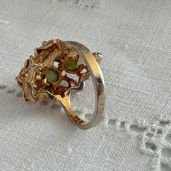 Vintage 1980s gold ring with jade oval cabochons and clear rhinestones in an organic sculptural setting, shown from multiple angles.