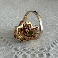 Vintage 1980s gold ring with jade oval cabochons and clear rhinestones in an organic sculptural setting, shown from multiple angles.